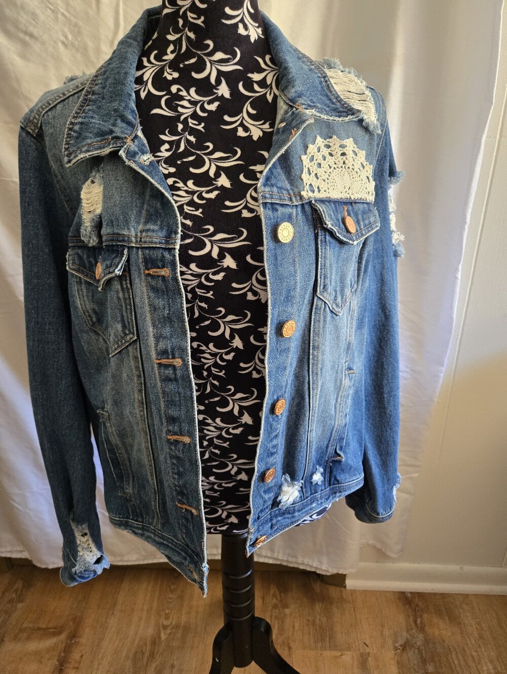 Women’s Distressed Blue Denim Jacket with Doily. Patch